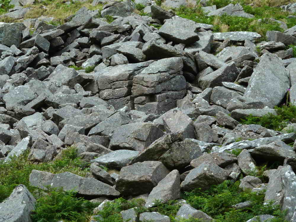 The cave is inside the cuboid rock formation