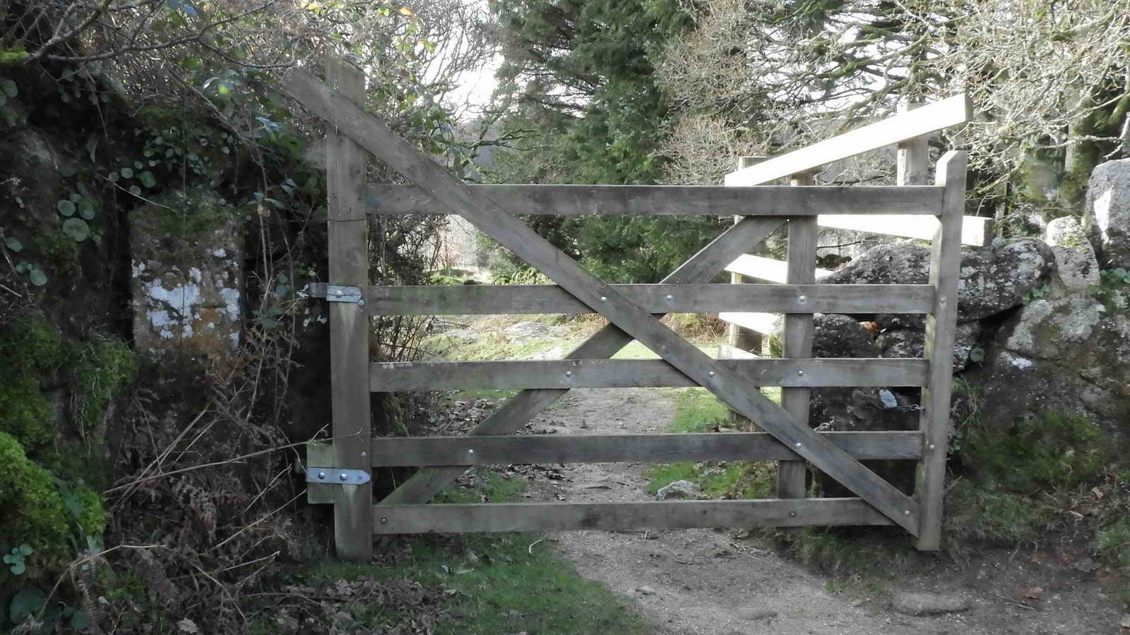 Close-up of the gate, with a PCWW pillar beside it