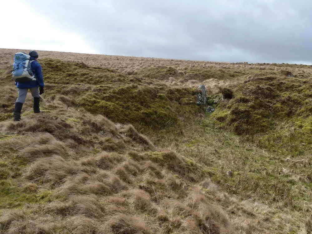 Near to the shaft is this site of an old reservoir where water was released through the sluice, positioned between the stones